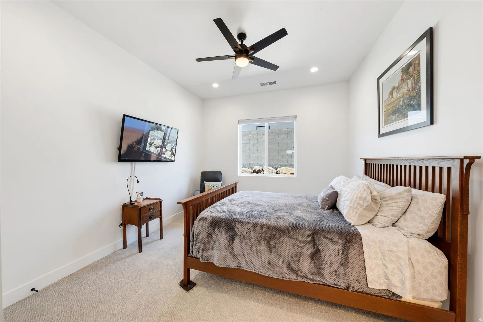 Carpeted flooring, recessed lighting, and a ceiling fan
