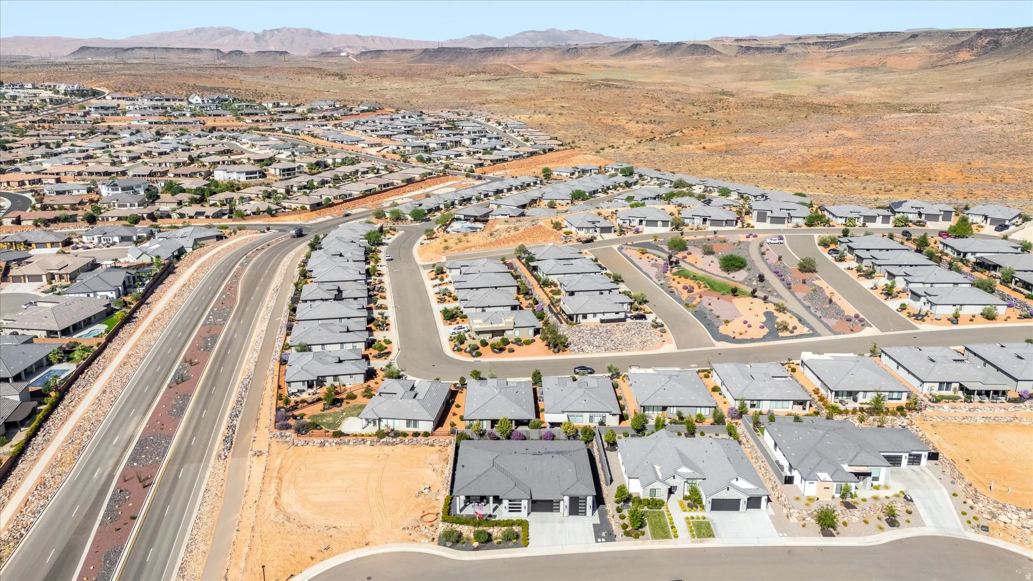 Residential development with varied architectural styles and gray roofing