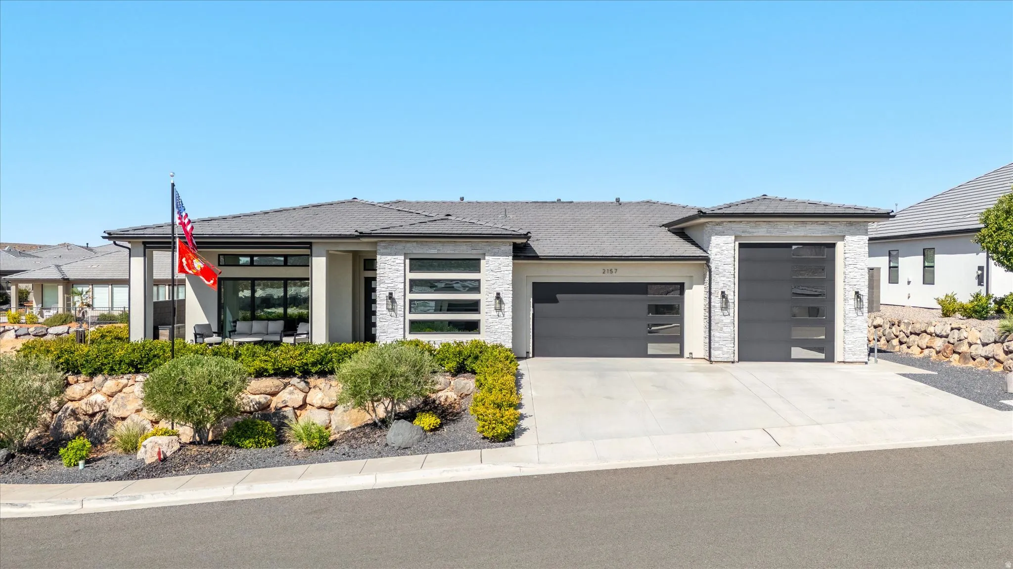 Stone facade residence with a dark tile roof