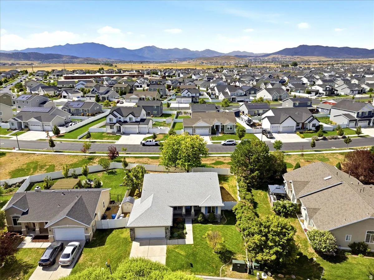 Expansive neighborhood setting with numerous properties and mountain backdrop