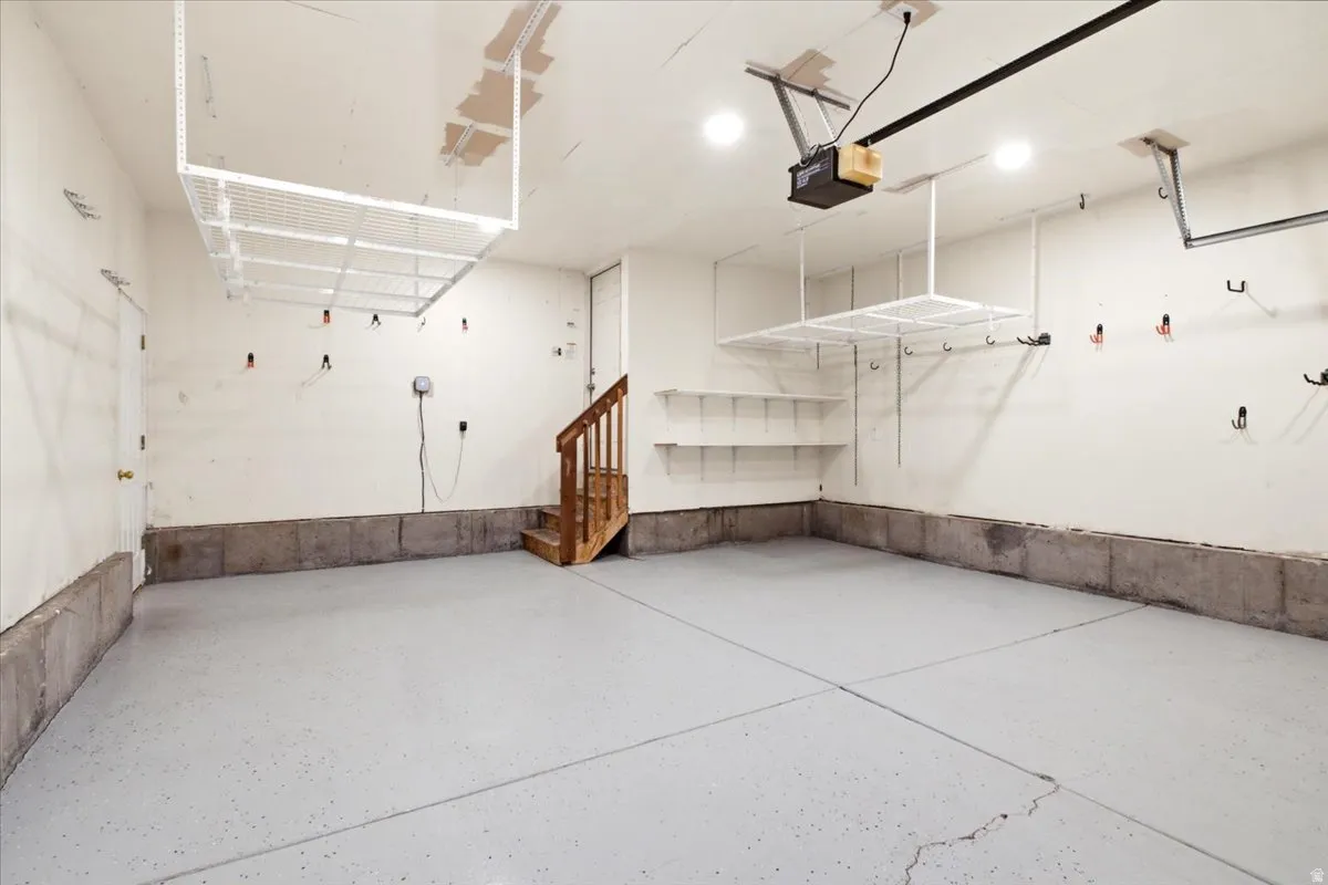 Expansive garage space featuring a light gray epoxy floor