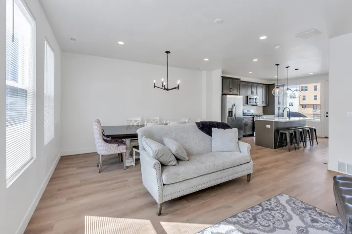 Open-concept living, dining and kitchen area with abundant natural light.