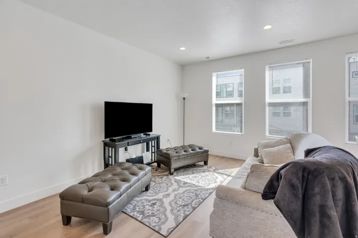Bright living room with large windows and open layout.
