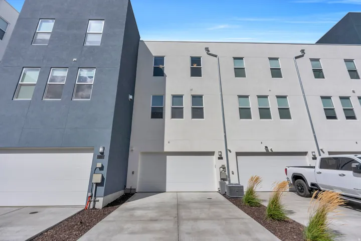 Attached two-car garage and rear access.