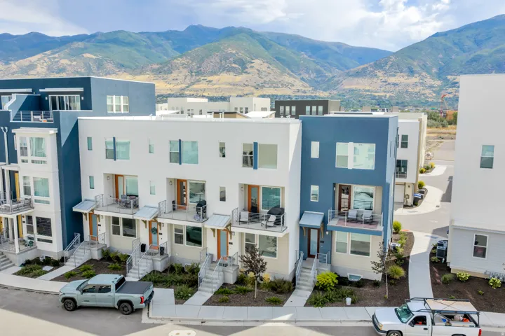 Aerial view of the townhome community with the Wasatch Mountains beyond.