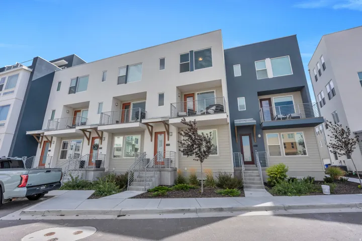 Modern Farmington townhome with private balcony and contemporary exterior.