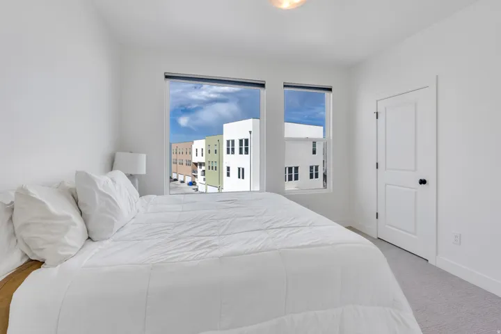 Primary bedroom with ample space and neutral finishes.