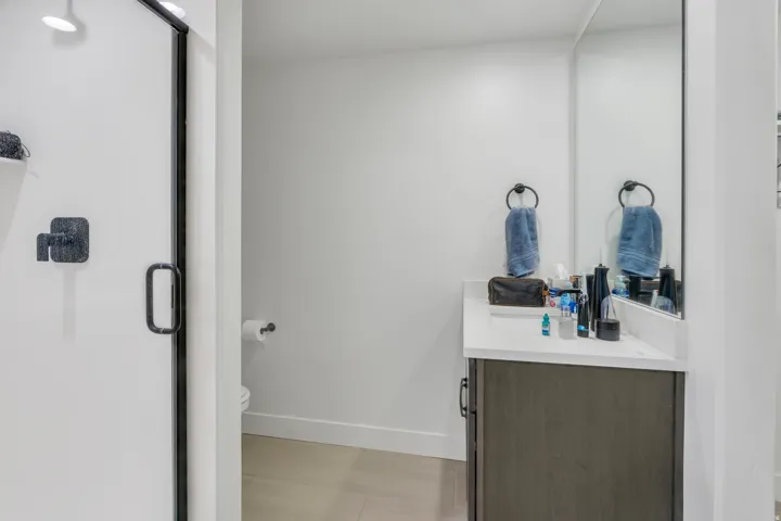 Full bathroom serving the private lower-level guest suite.