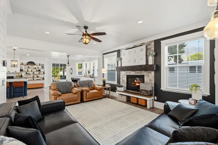 Wood-finish flooring, recessed lighting, and a ceiling fan with integrated lighting