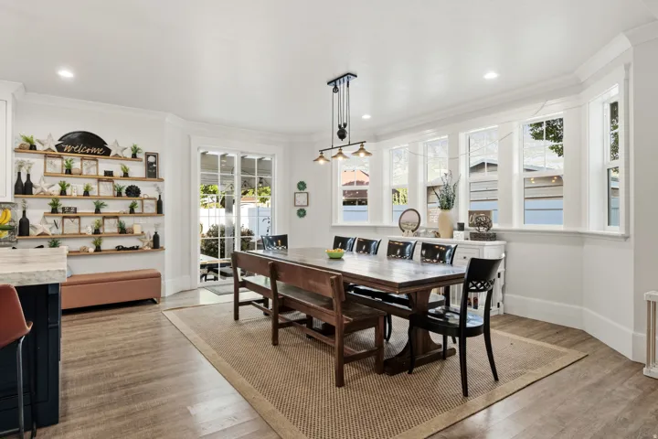 Wood-finish flooring, recessed lighting, and a bay window featuring multiple panes