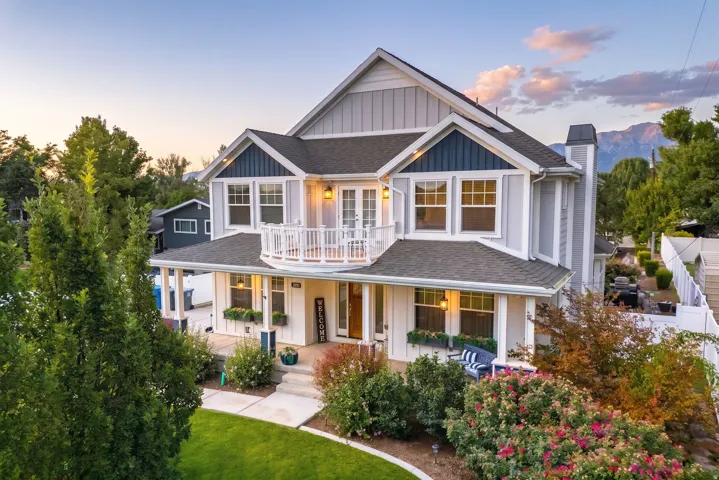 Two-story residence with a covered front porch and an upper-level balcony