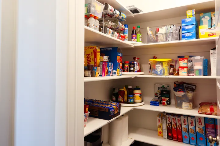 Recessed pantry with L-shaped shelving