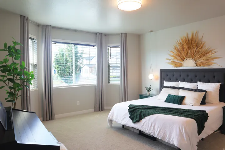 Carpeted flooring, recessed lighting, and a broad window with blinds