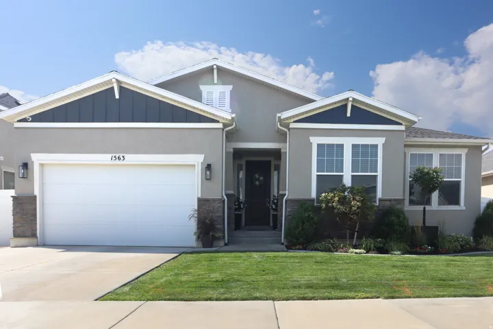 Stucco exterior with stone veneer accents