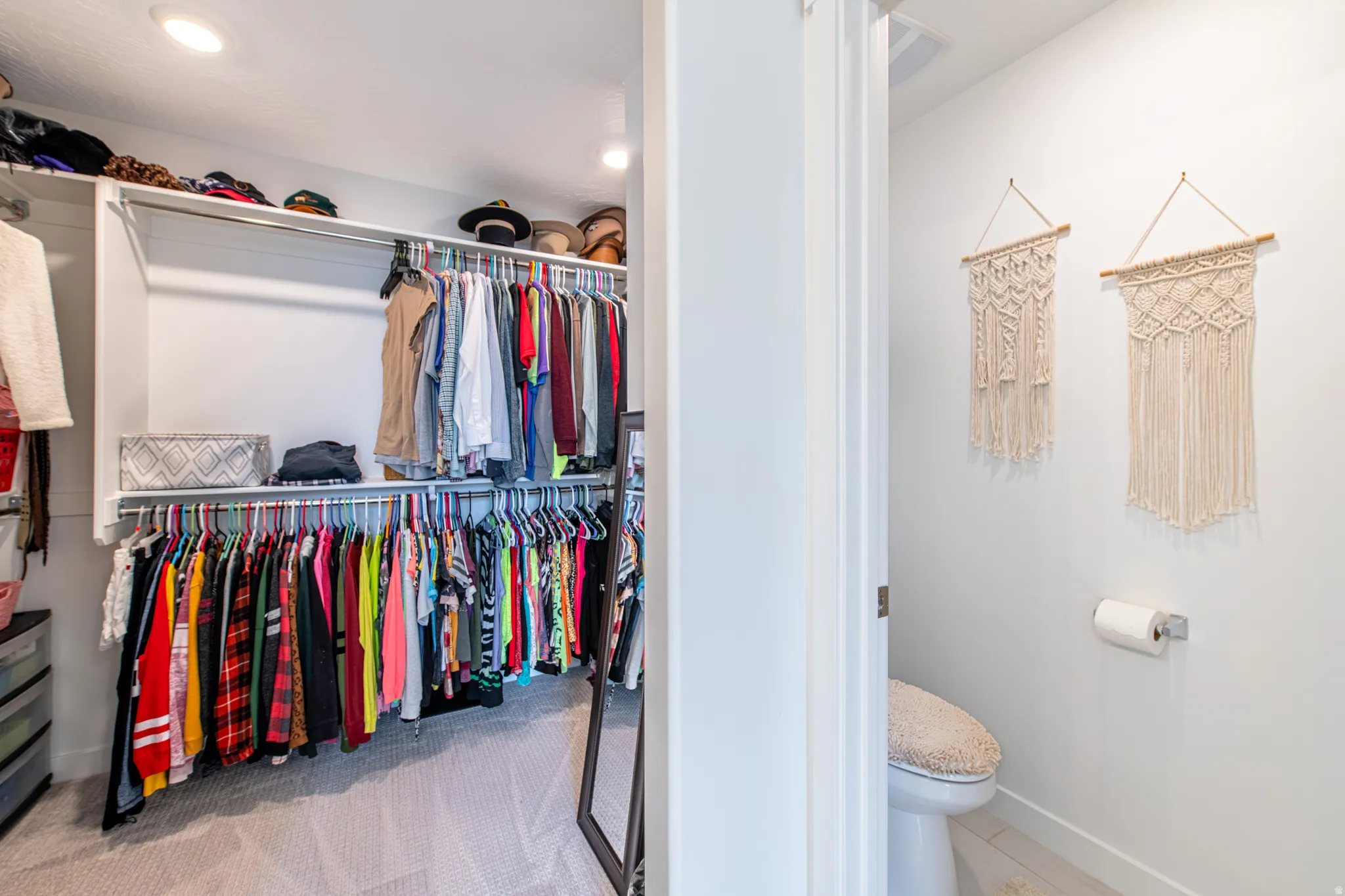 Walk-in closet with integrated shelving and hanging rods