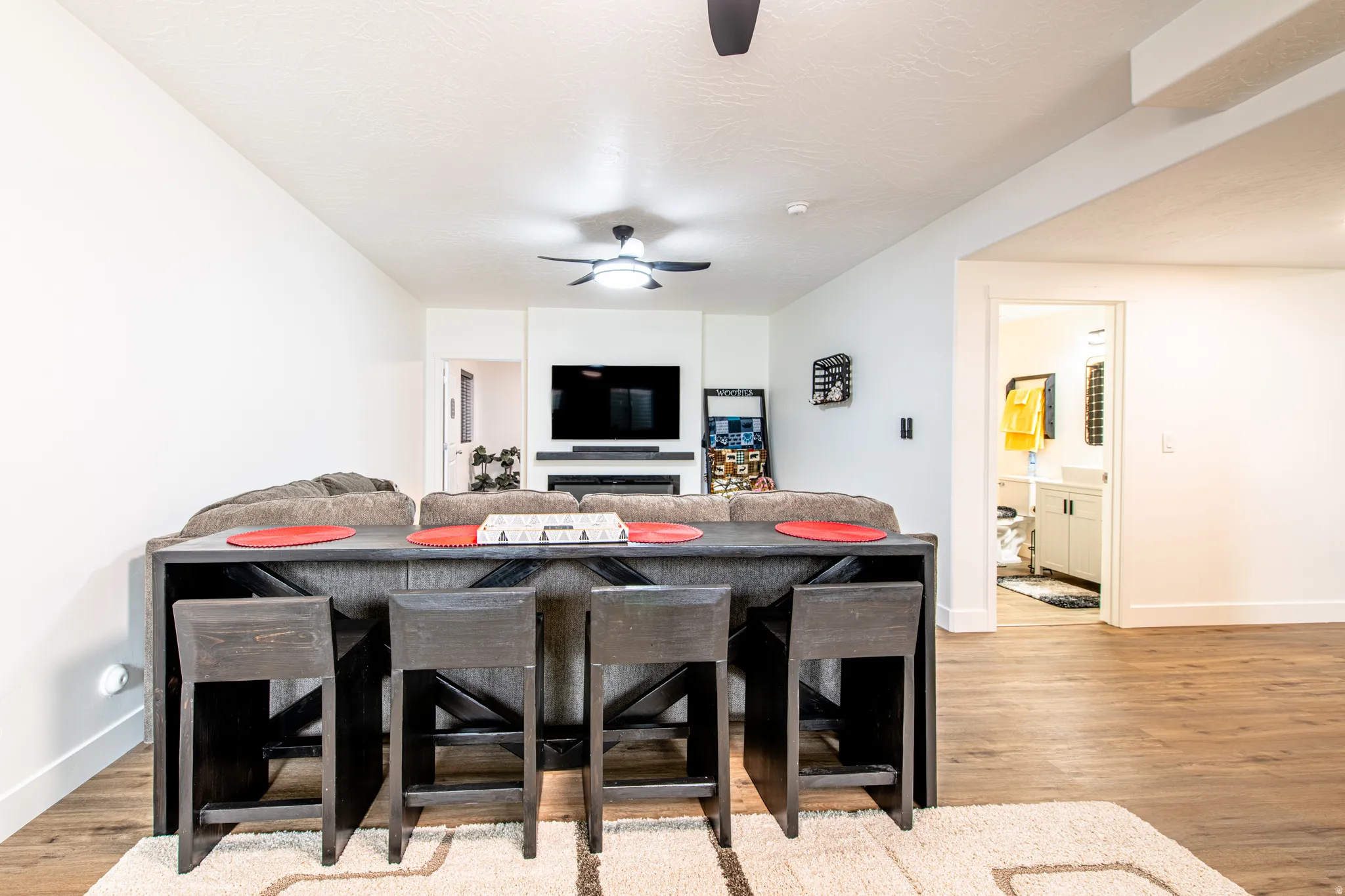 Wood-finish flooring, recessed lighting, and a ceiling fan