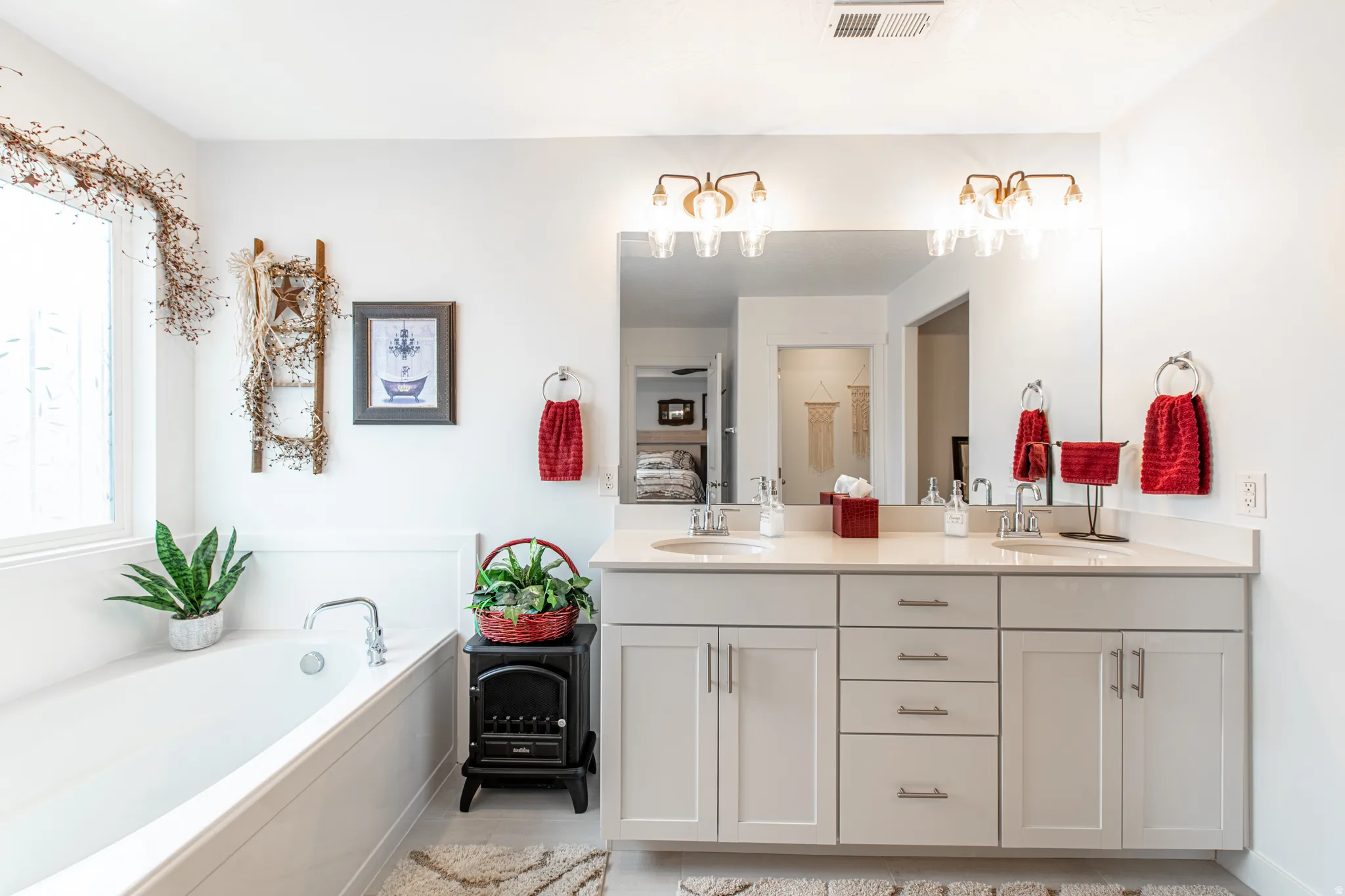 Dual vanity with light-toned cabinetry and brushed nickel hardware