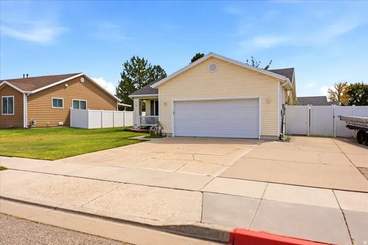 Yellow siding exterior with white trim details