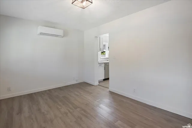 Wood-finish flooring, recessed lighting fixture, and a mini-split system