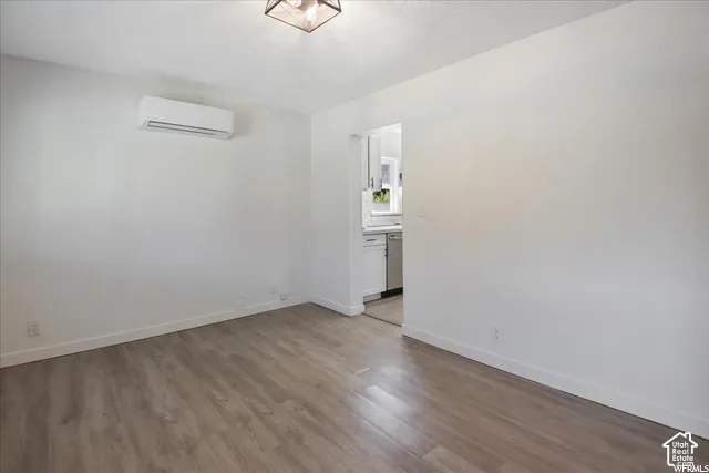 Wood-finish flooring, recessed lighting fixture, and a mini-split system