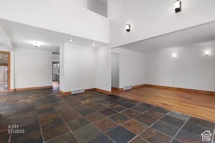 Expansive open-concept living space with high ceilings