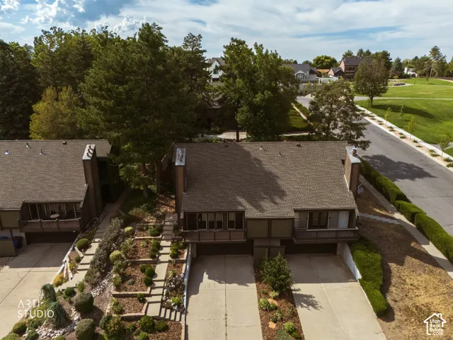 Brown shingle roof with a prominent chimney structure