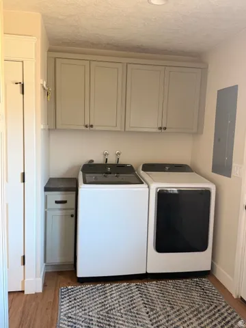 Built-in cabinetry with four upper cabinets, a lower cabinet, and a countertop