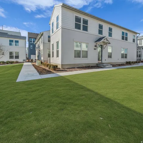 Contemporary exterior design with white siding and light-colored stucco