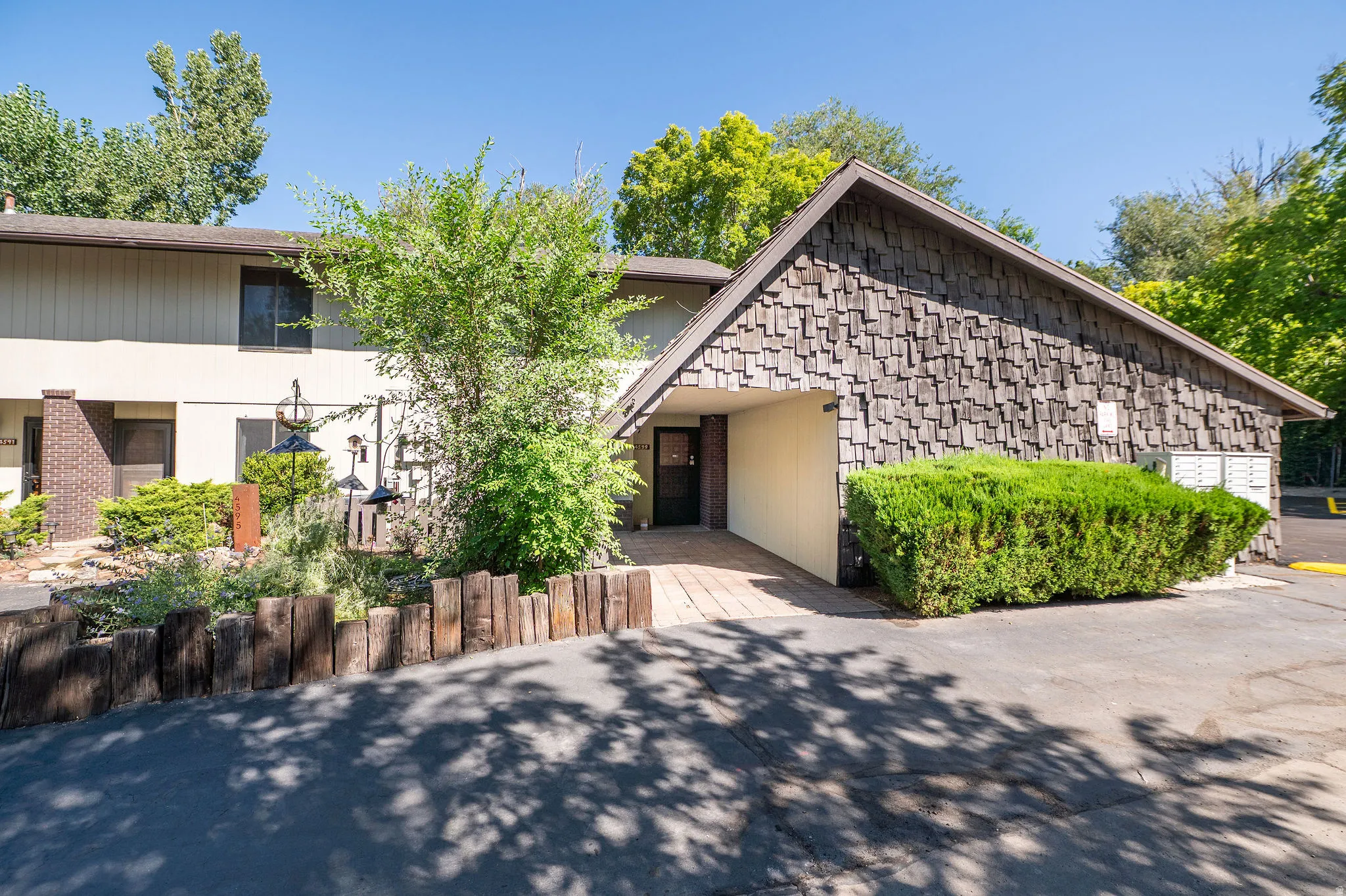 Wood shingle exterior with a covered entry