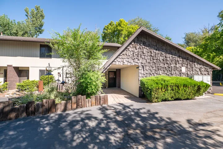 Wood shingle exterior with a covered entry