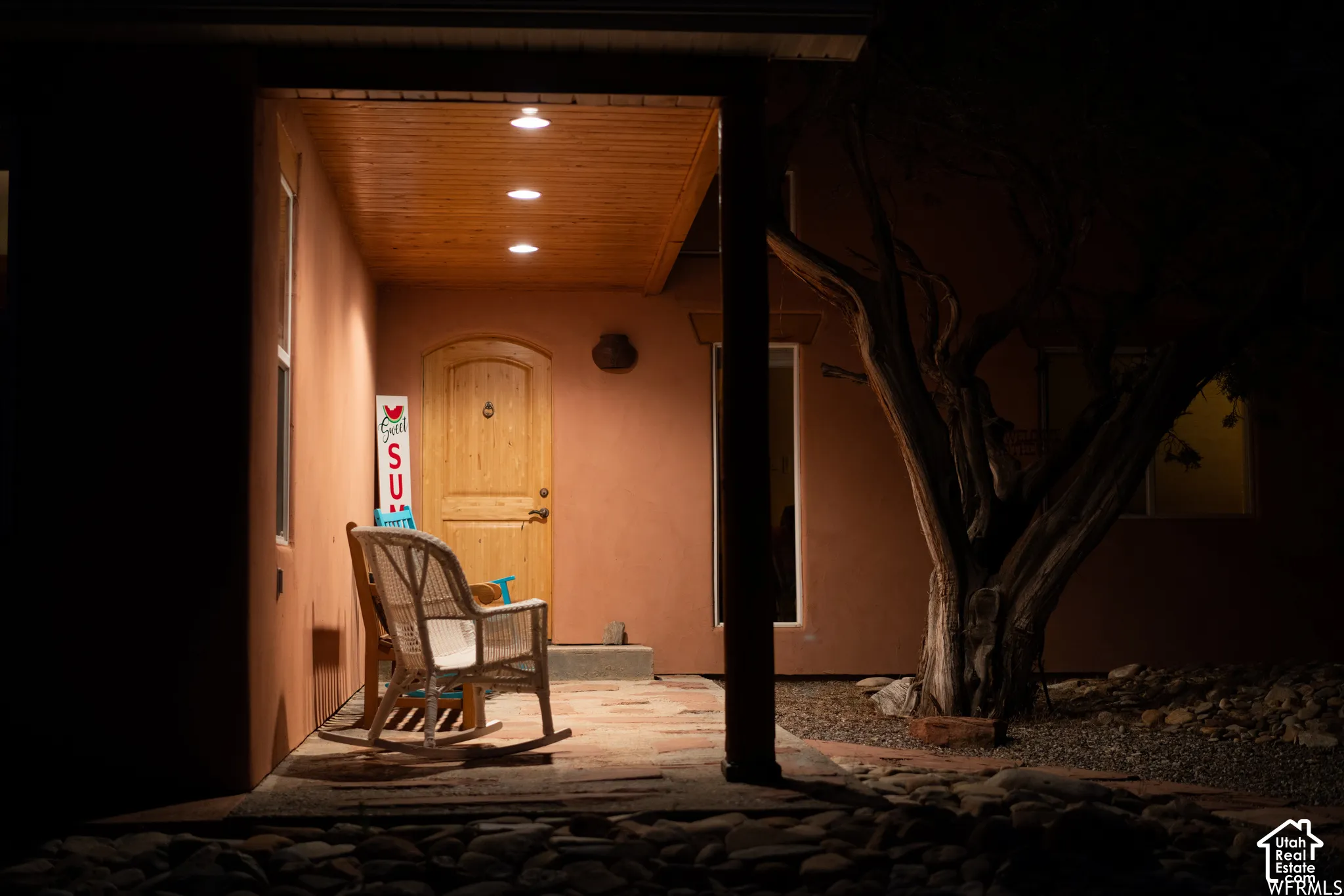 Covered entryway featuring a wood-paneled ceiling with recessed lighting
