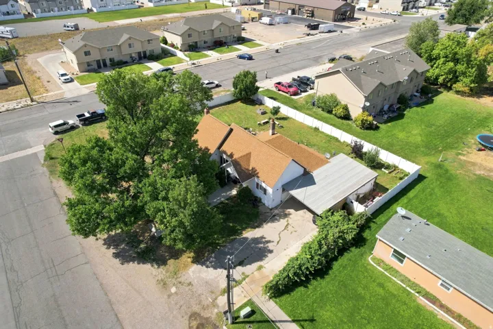 Expansive front yard with mature trees