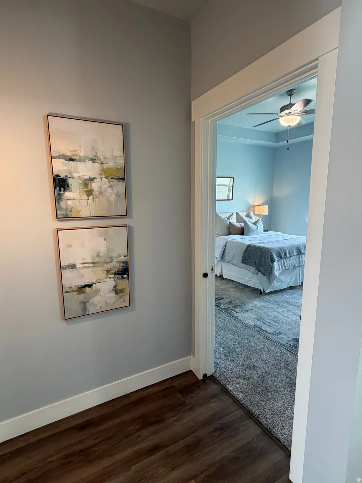 Wood-finish flooring with white baseboards