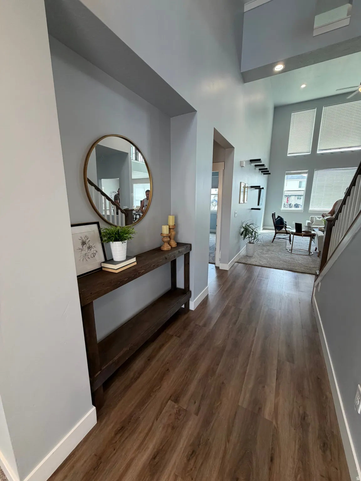 LVP flooring, high ceilings, recessed lighting, and a multi-level floorplan