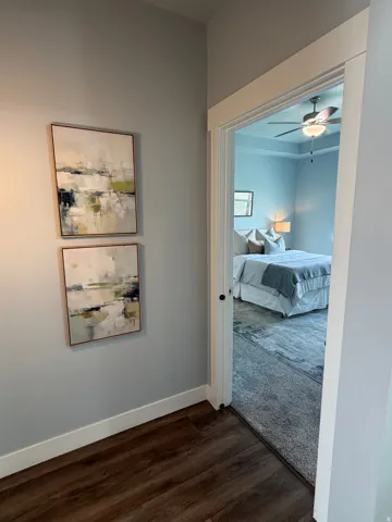 Wood-finish flooring with white baseboards