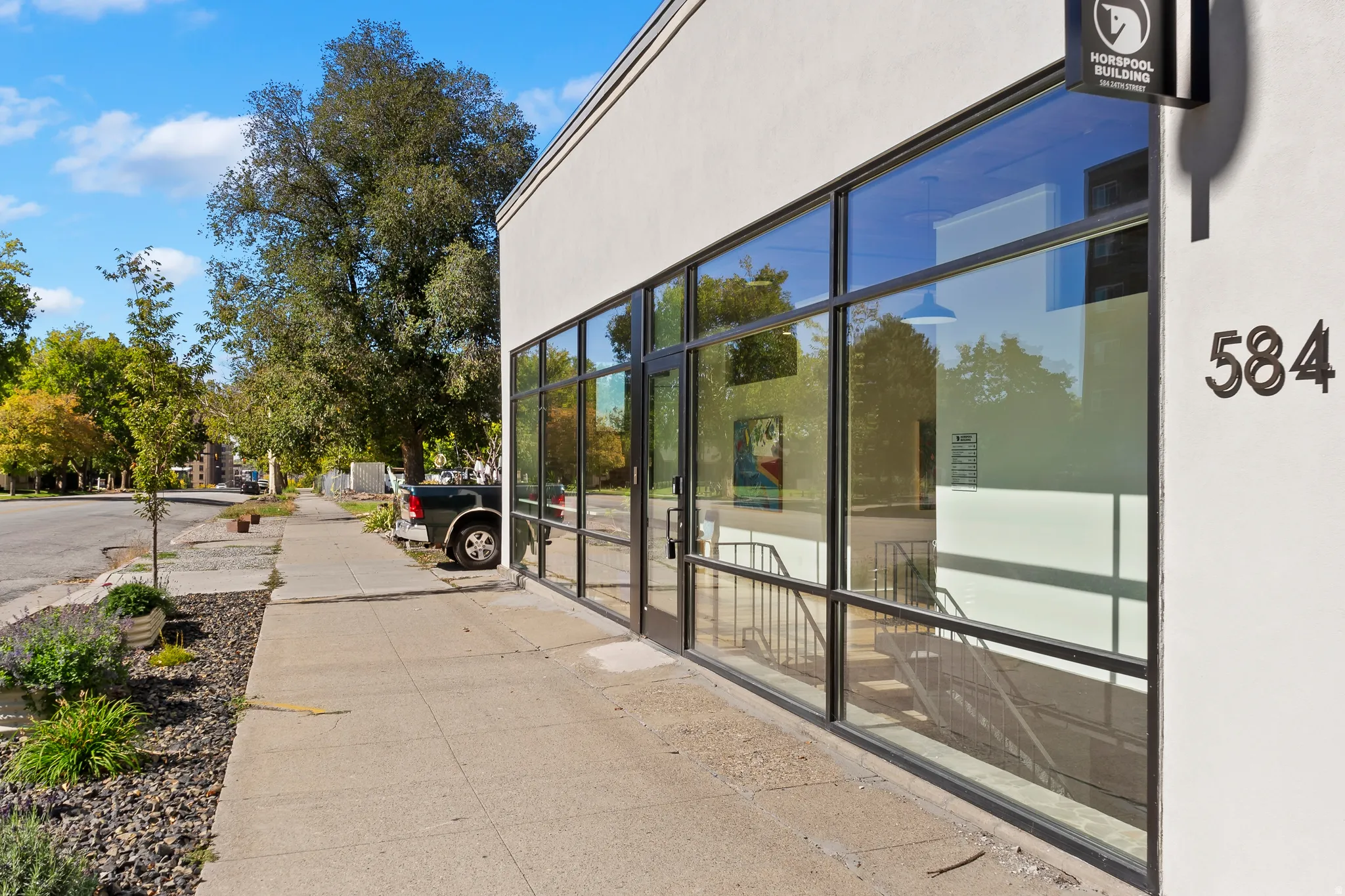 Modern commercial facade with expansive glass storefront