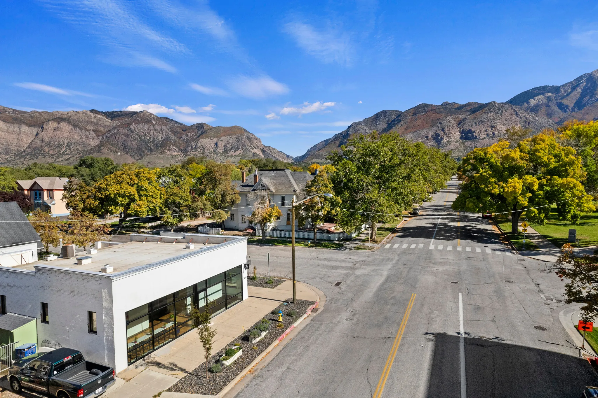 Modern commercial building with large storefront windows and flat roof