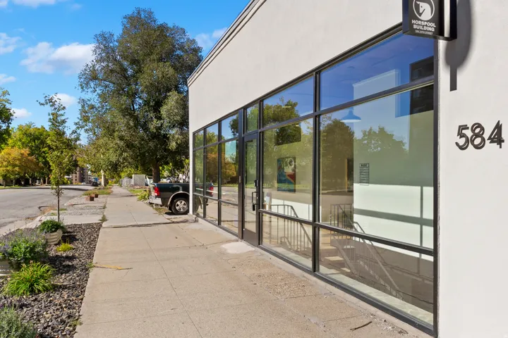 Modern commercial facade with expansive glass storefront