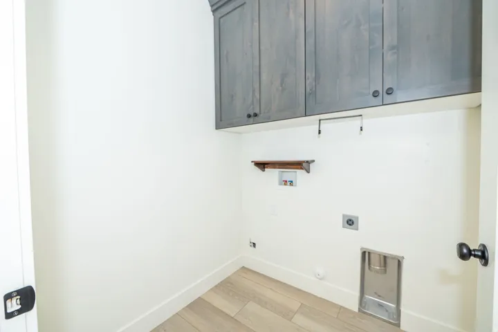 Gray wood-finish cabinetry with black hardware