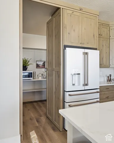 Custom cabinetry with integrated refrigerator