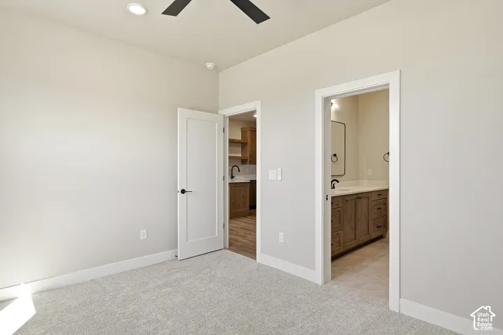 Wall-to-wall carpeting and white trim throughout