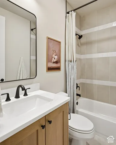 Light wood-finish vanity with a white countertop and integrated sink