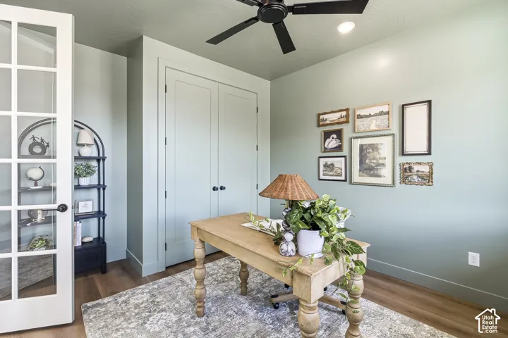 French doors with glass panes, wood-finish flooring, recessed lighting, and a ceiling fan