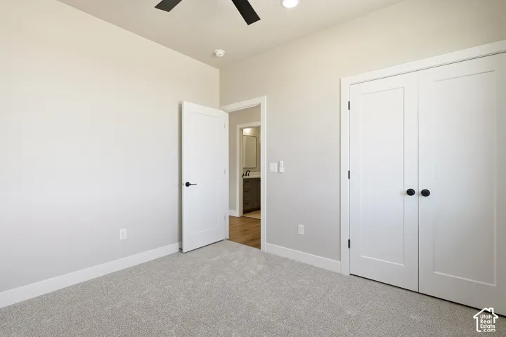 Carpeted flooring, white trim, recessed lighting, and a ceiling fan