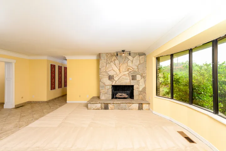 Stone fireplace with raised hearth