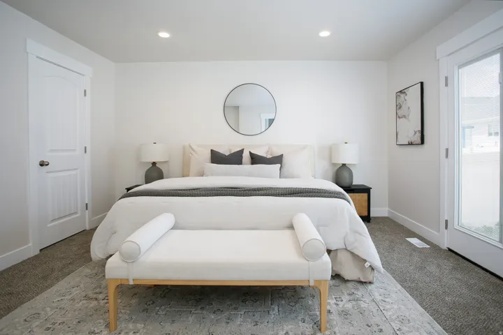 Recessed lighting, white walls, and a full-light exterior door