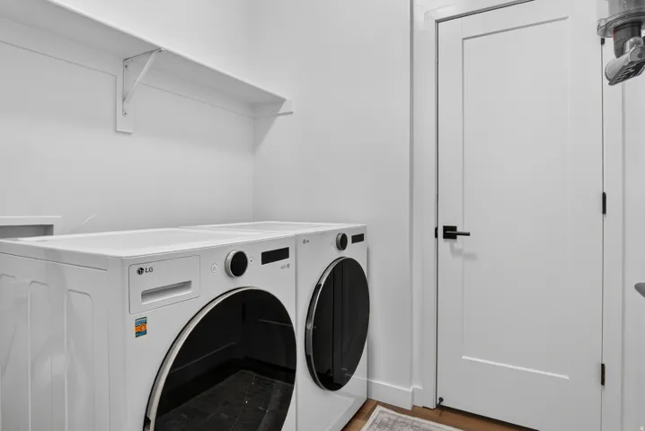 White wall shelving, solid core interior door, and matte black hardware