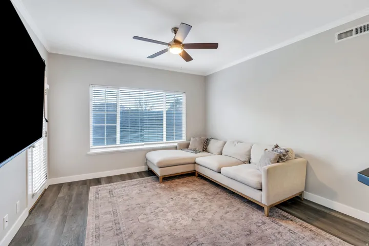 Spacious living room with laminate flooring
