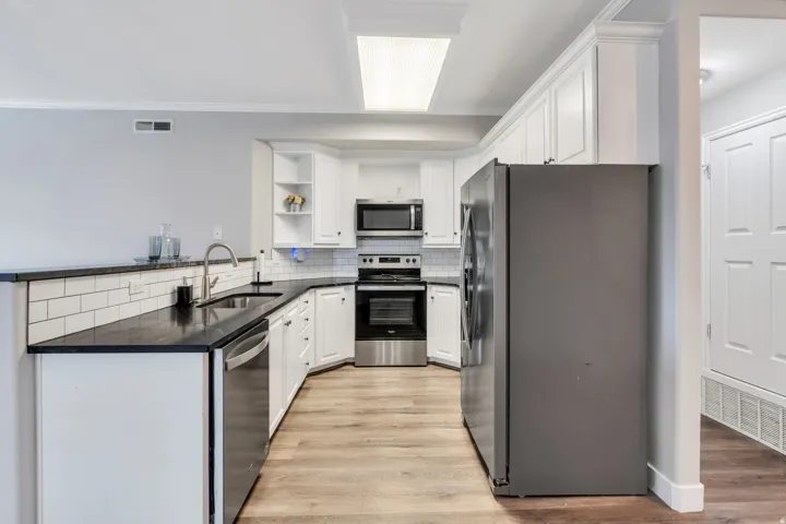 White cabinetry provides ample storage