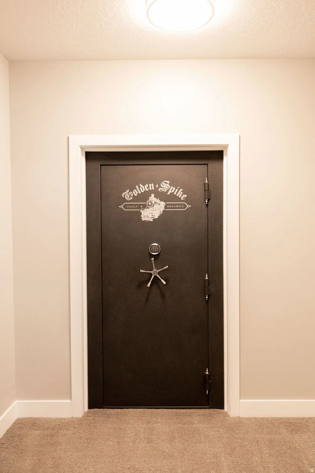 Secure vault door with combination lock and five-spoke handle